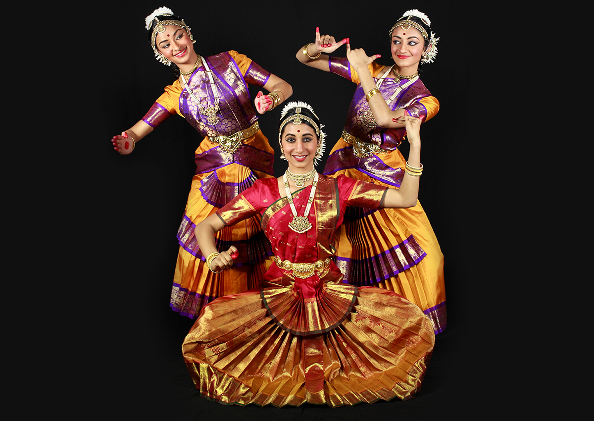 4 girls in a bharatnatyam pose